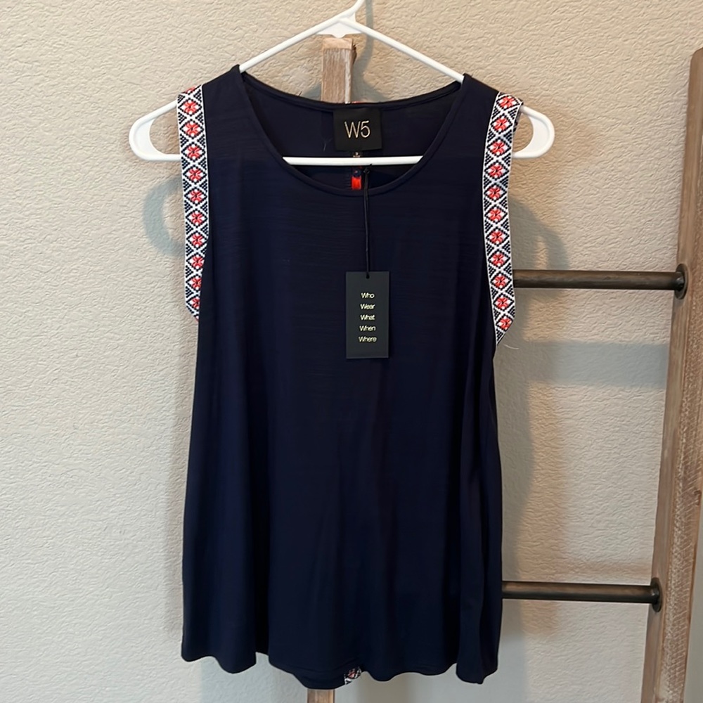 Soft blue tank with orange stitching